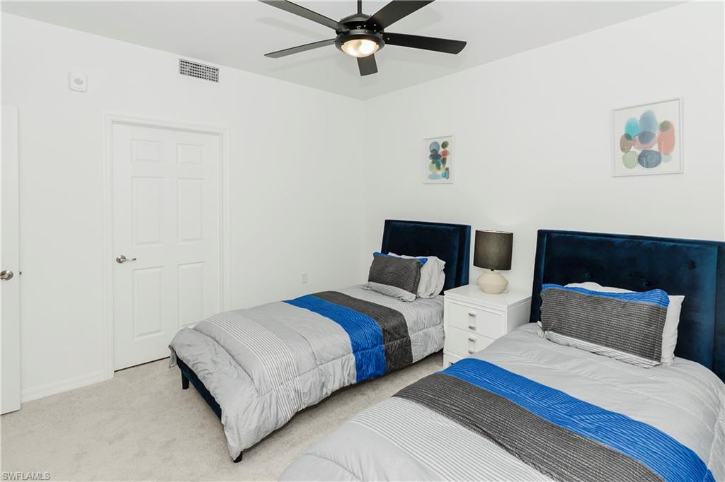 43993 Boardwalk Loop, Unit 1928 Babcock Ranch, FL 33982 - Photo 21 of 50 a bedroom with bed and window