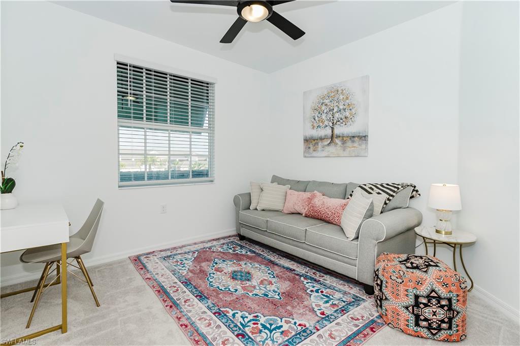 43993 Boardwalk Loop, Unit 1928 Babcock Ranch, FL 33982 - Photo 22 of 50 a living room with furniture and a window