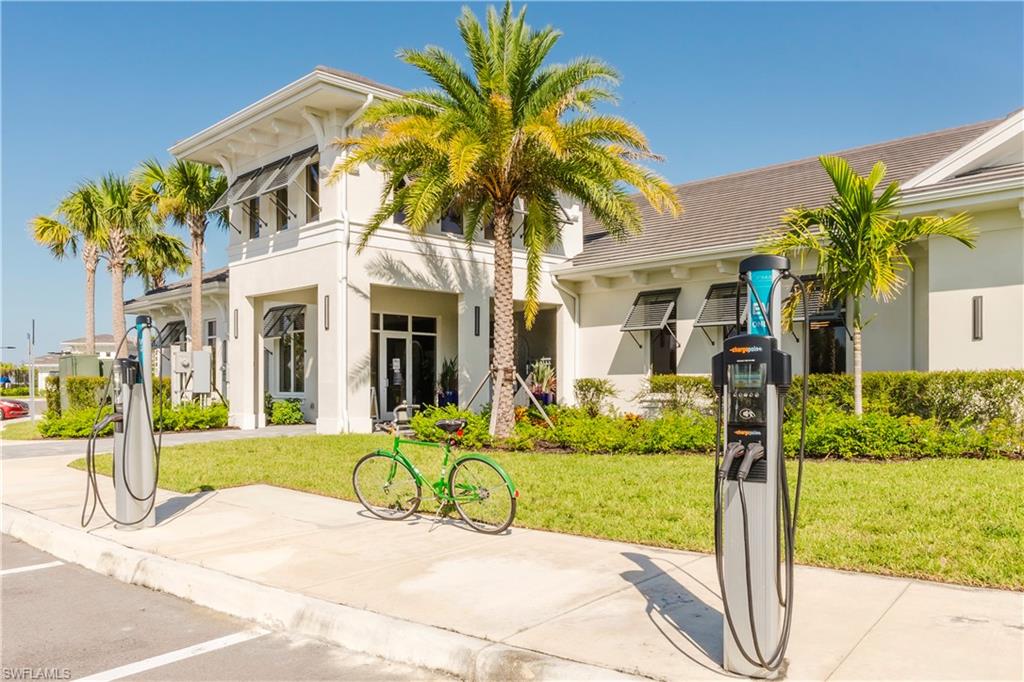 43993 Boardwalk Loop, Unit 1928 Babcock Ranch, FL 33982 - Photo 30 of 50 a view of a house with backyard porch and garden