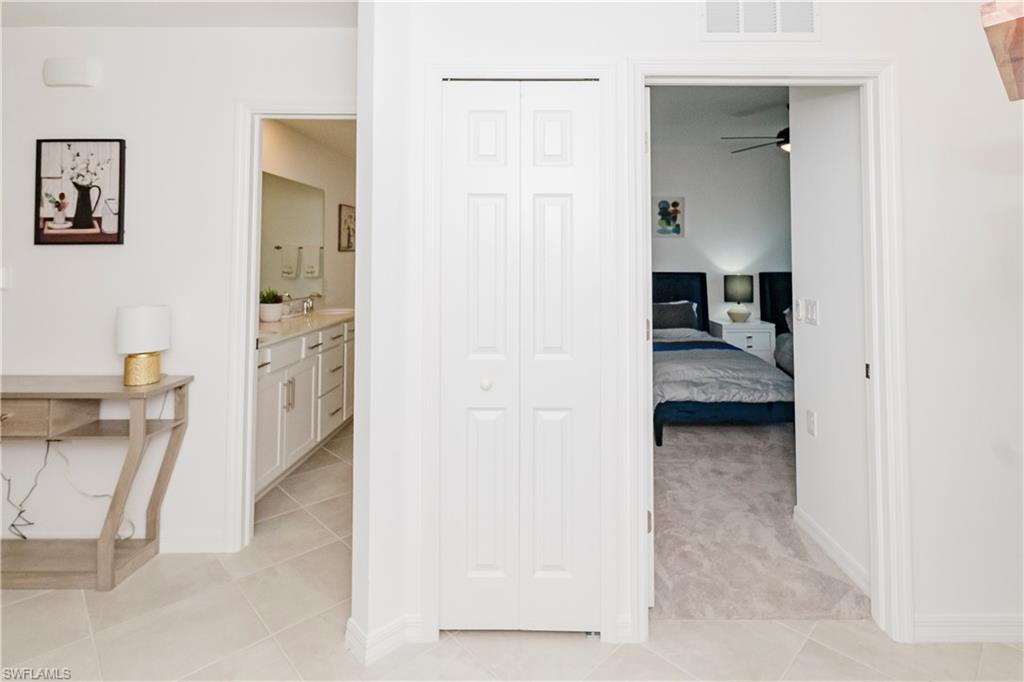 43993 Boardwalk Loop, Unit 1928 Babcock Ranch, FL 33982 - Photo 3 of 50 a view of a bedroom from a hallway
