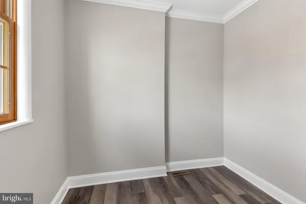 a view of small space with wooden floor