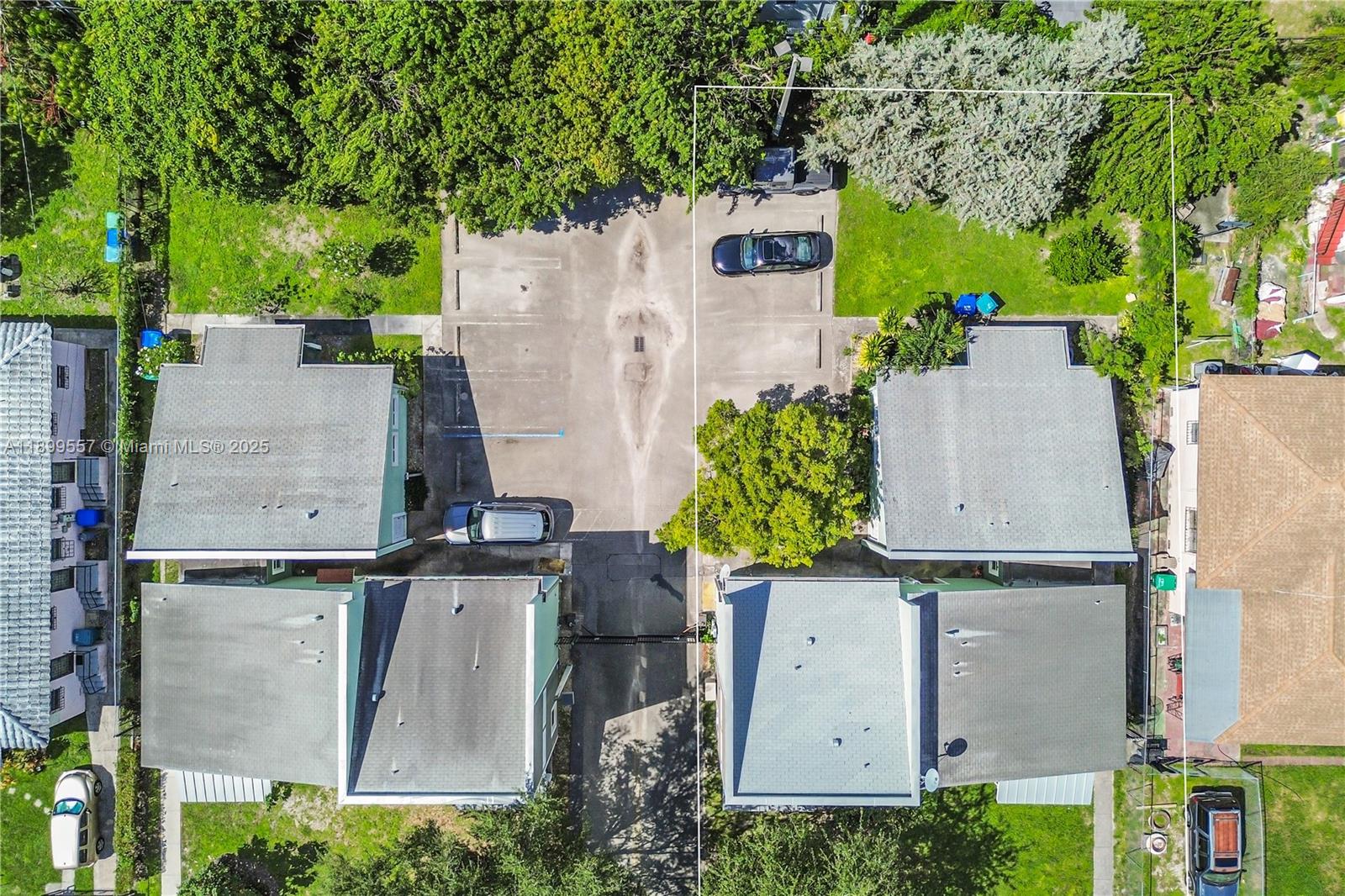 6960 Northwest 4th Avenue, Unit 3 Miami, FL 33150 - Photo 24 of 28 an aerial view of residential houses with outdoor space and parking