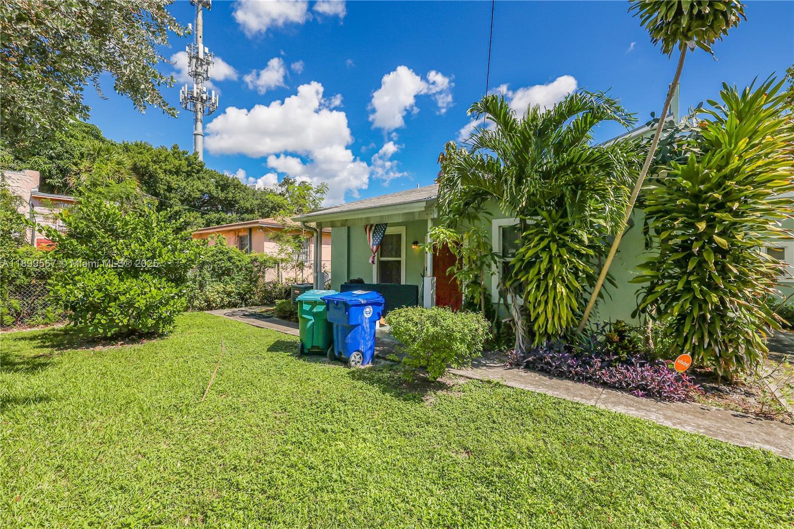6960 Northwest 4th Avenue, Unit 3 Miami, FL 33150 - Photo 28 of 28 a view of a house with backyard sitting area and garden