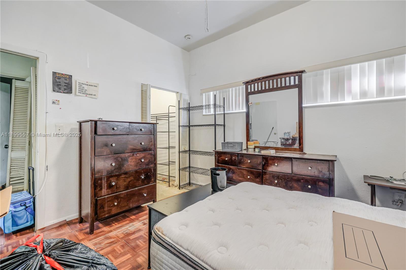 6960 Northwest 4th Avenue, Unit 3 Miami, FL 33150 - Photo 7 of 28 a bedroom with a bed and furniture