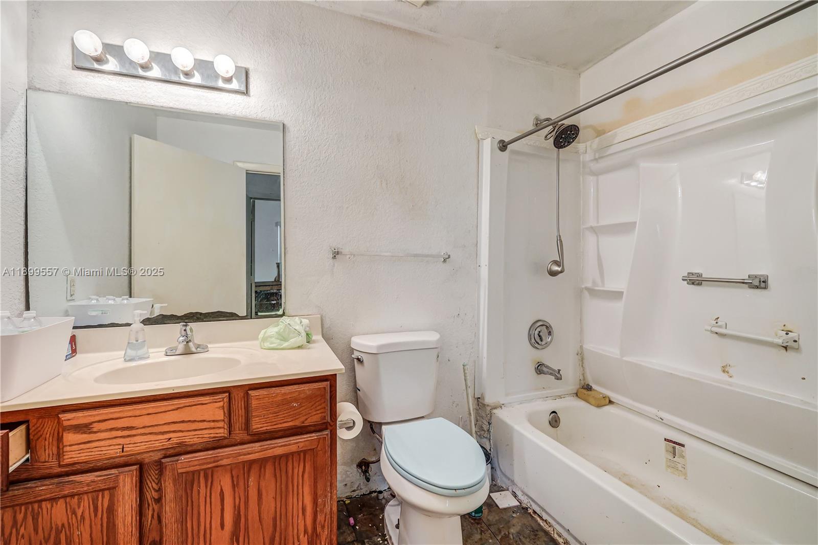 6960 Northwest 4th Avenue, Unit 3 Miami, FL 33150 - Photo 10 of 28 a bathroom with a sink a toilet and a bathtub