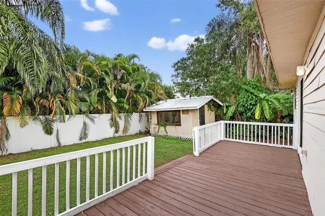 a view of wooden deck and a yard