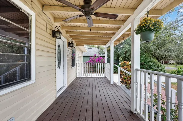 a view of a balcony with wooden floor