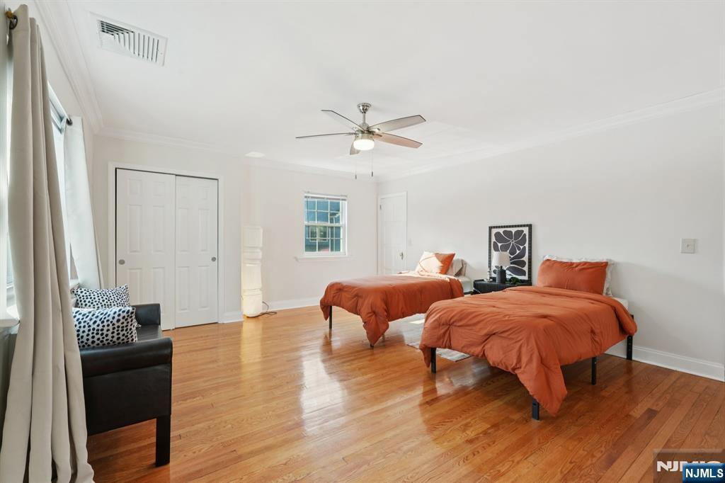 1486 Windsor Road Teaneck, NJ 07666 - Photo 19 of 24 a bedroom with furniture and a window