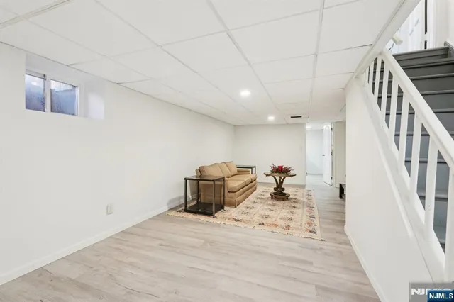a bed room with a bed and a potted plant