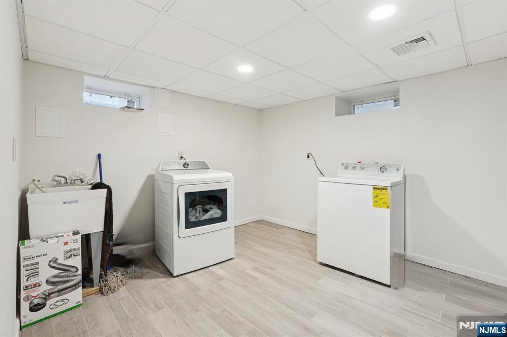 1486 Windsor Road Teaneck, NJ 07666 - Photo 22 of 24 a utility room with dryer and washer
