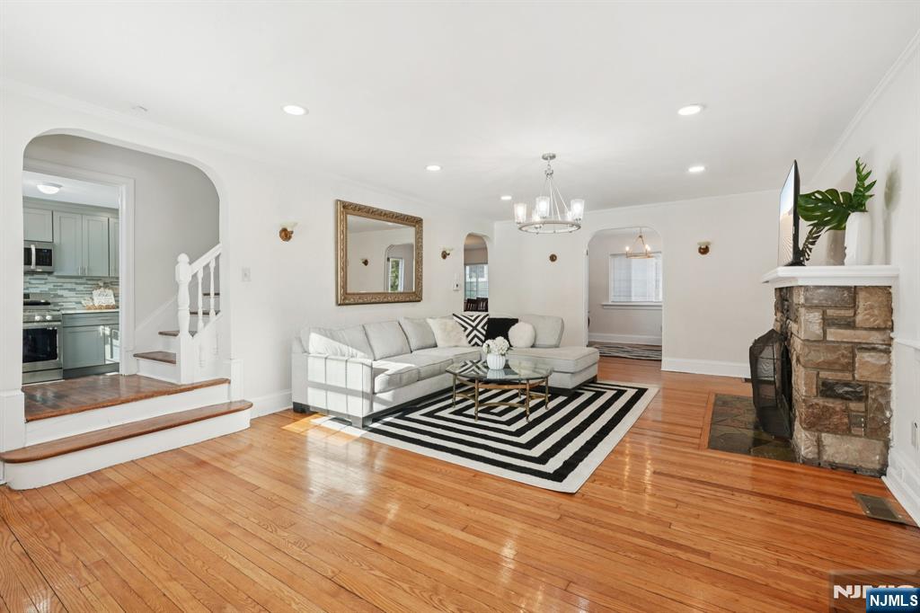 1486 Windsor Road Teaneck, NJ 07666 - Photo 6 of 24 a living room with furniture and a fireplace