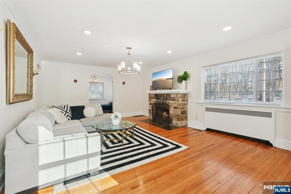1486 Windsor Road Teaneck, NJ 07666 - Photo 7 of 24 a living room with furniture and a fireplace