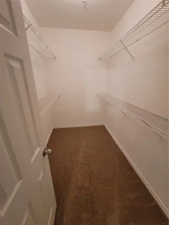 a view of a room with racks on the wall