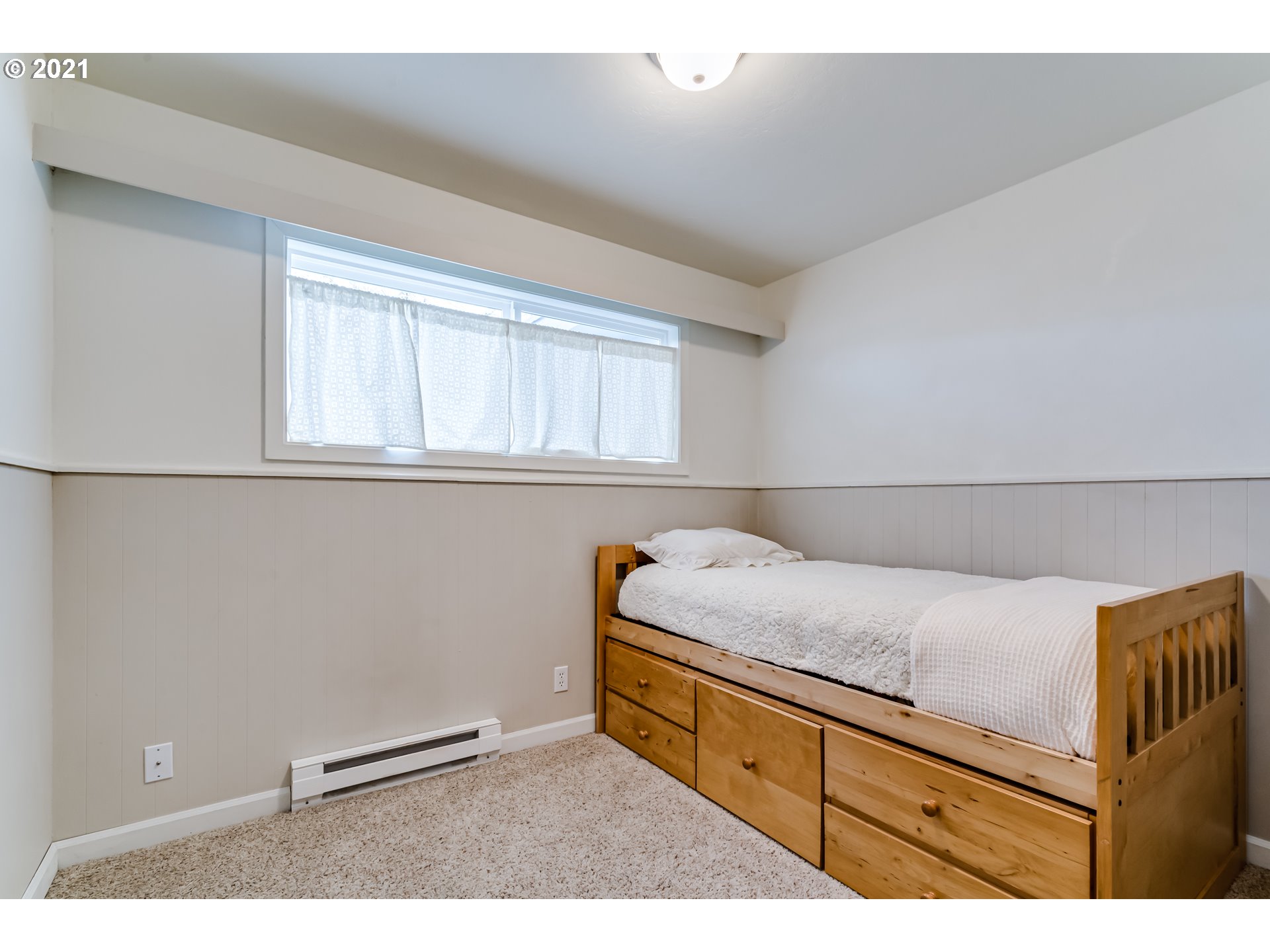 1438 I Street Springfield, OR 97477 - Photo 22 of 32 a bedroom with a bed and a window
