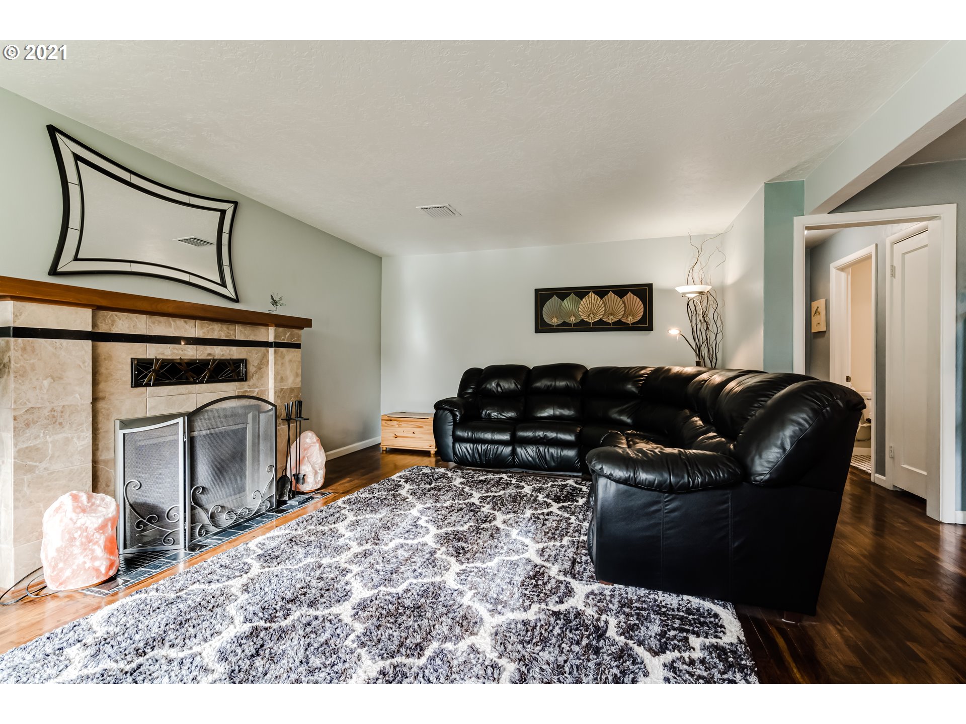 1438 I Street Springfield, OR 97477 - Photo 4 of 32 a living room with furniture a fireplace and wooden floor