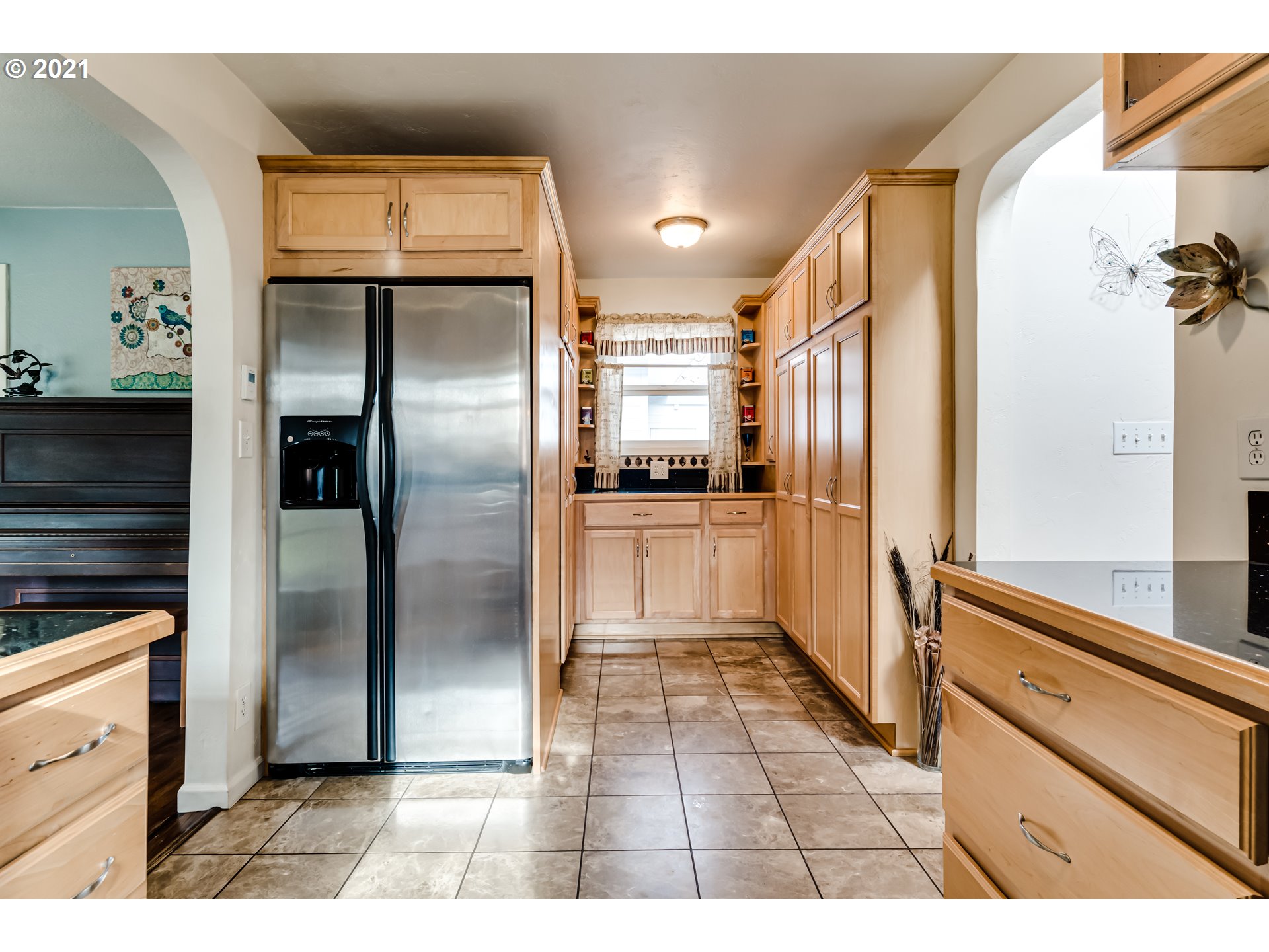 1438 I Street Springfield, OR 97477 - Photo 8 of 32 a kitchen with stainless steel appliances kitchen island granite countertop a refrigerator and a sink
