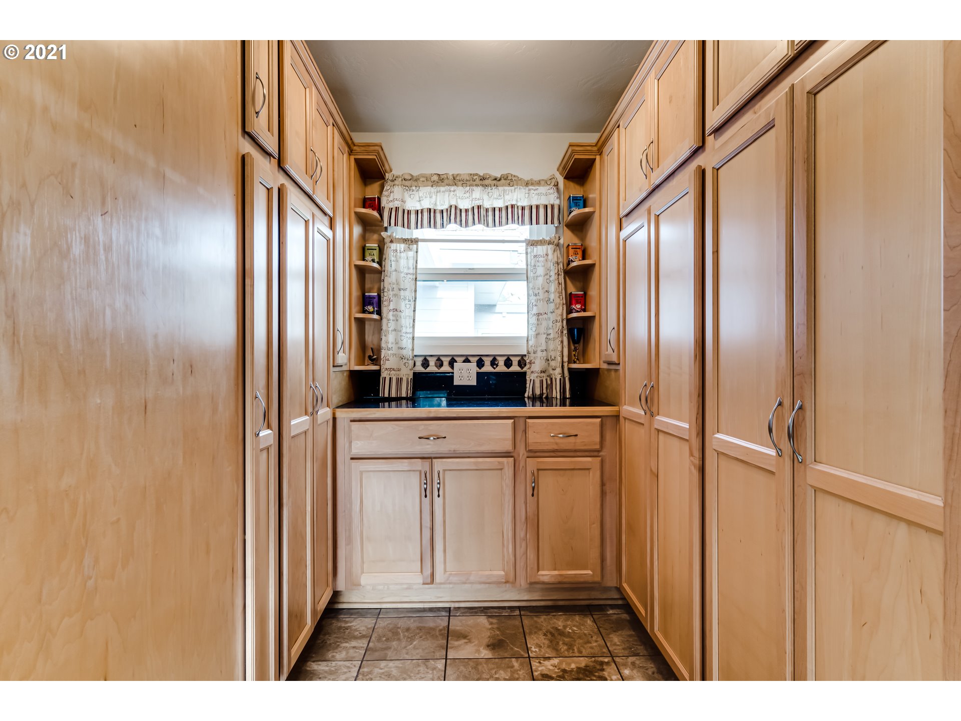 1438 I Street Springfield, OR 97477 - Photo 9 of 32 a kitchen with stainless steel appliances a refrigerator and a window