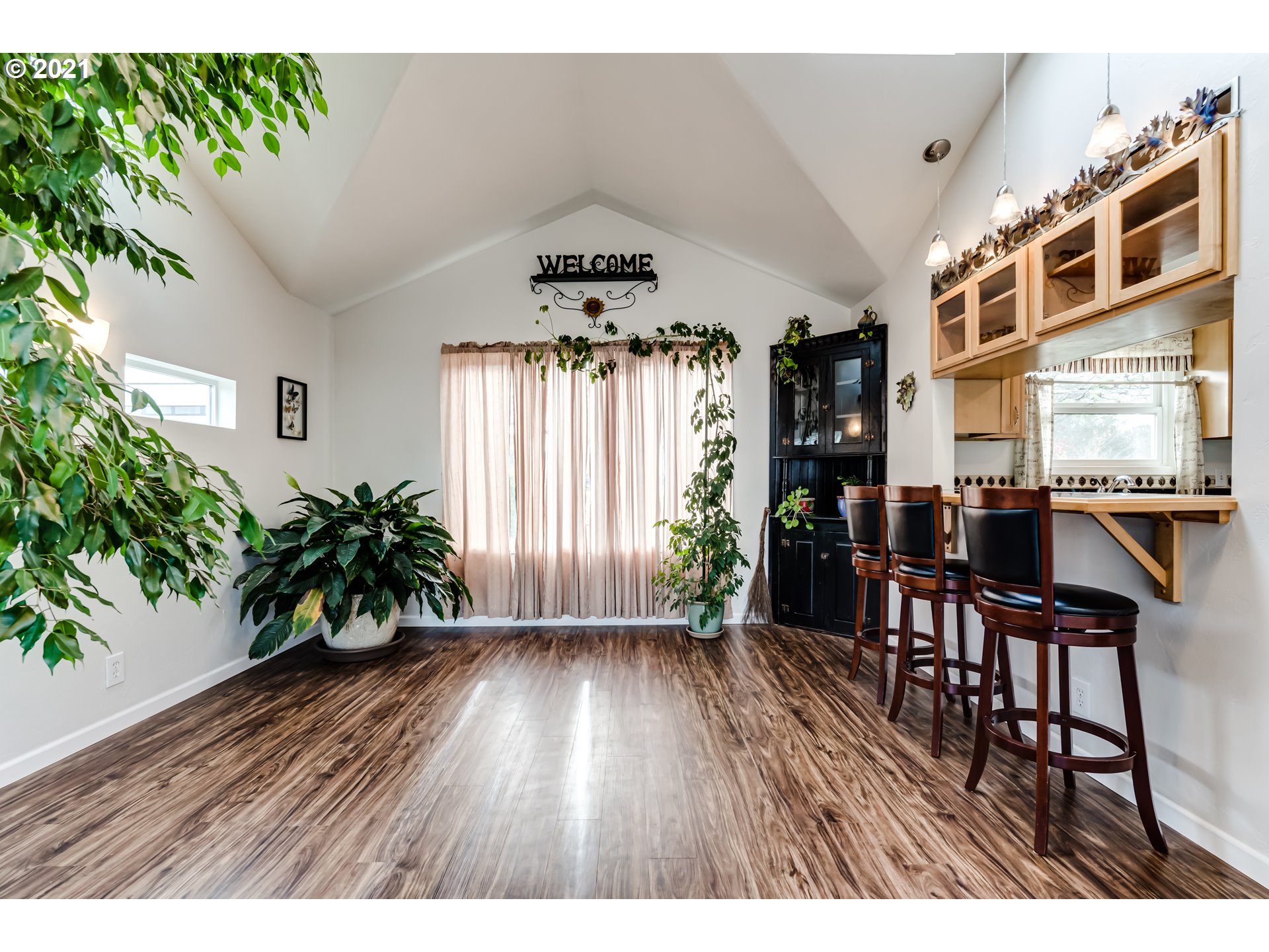 1438 I Street Springfield, OR 97477 - Photo 10 of 32 a open hall with furniture and wooden floor