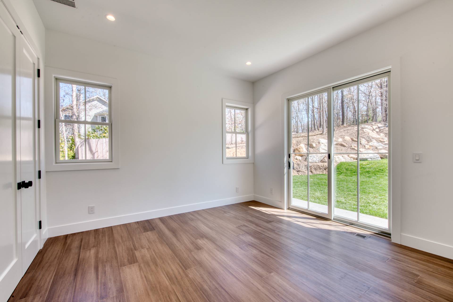 18 Barnes Avenue East Hampton, NY 11937 - Photo 13 of 35 a view of an empty room with wooden floor and a window
