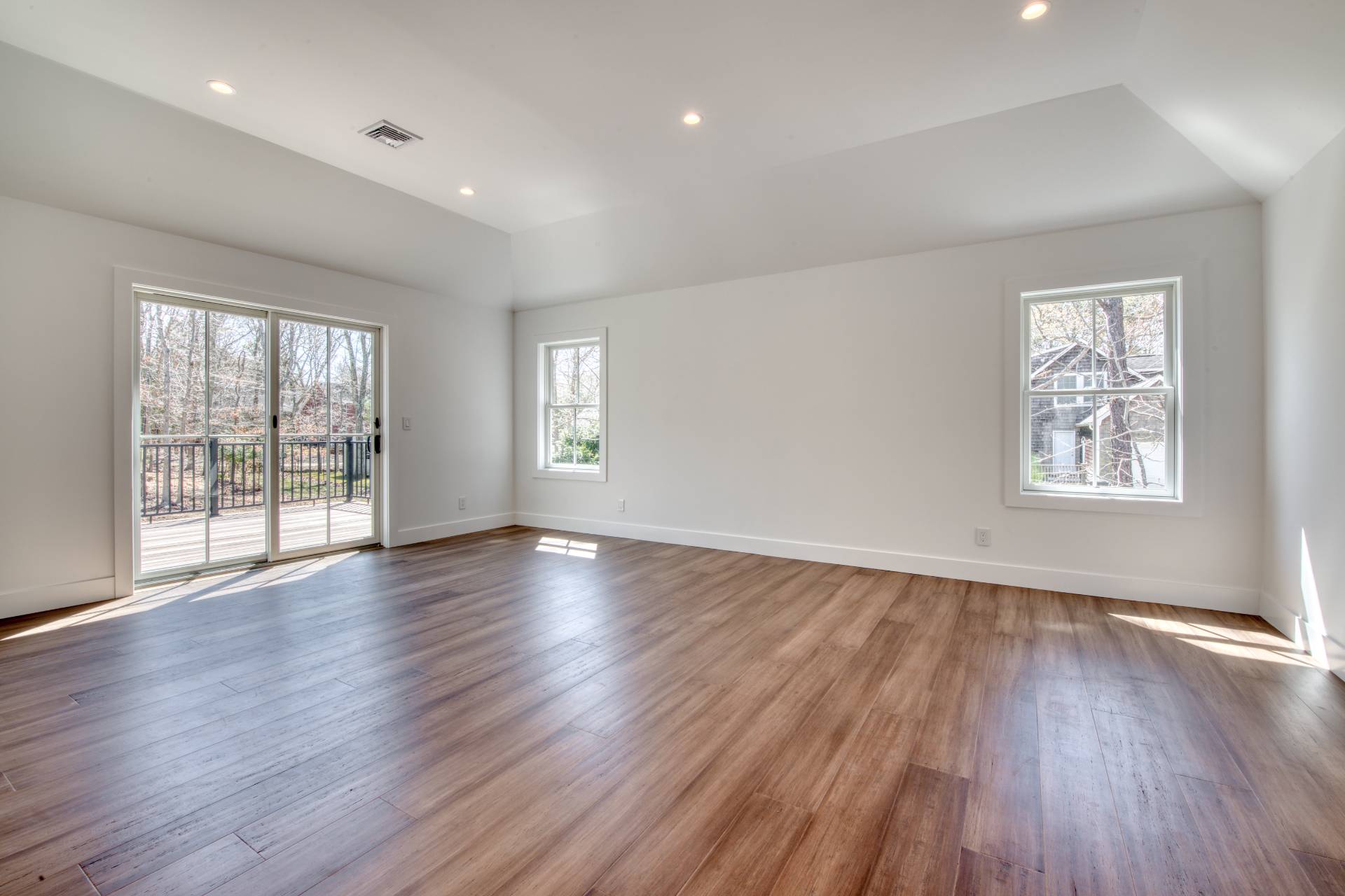 18 Barnes Avenue East Hampton, NY 11937 - Photo 16 of 35 a view of an empty room with wooden floor and a window
