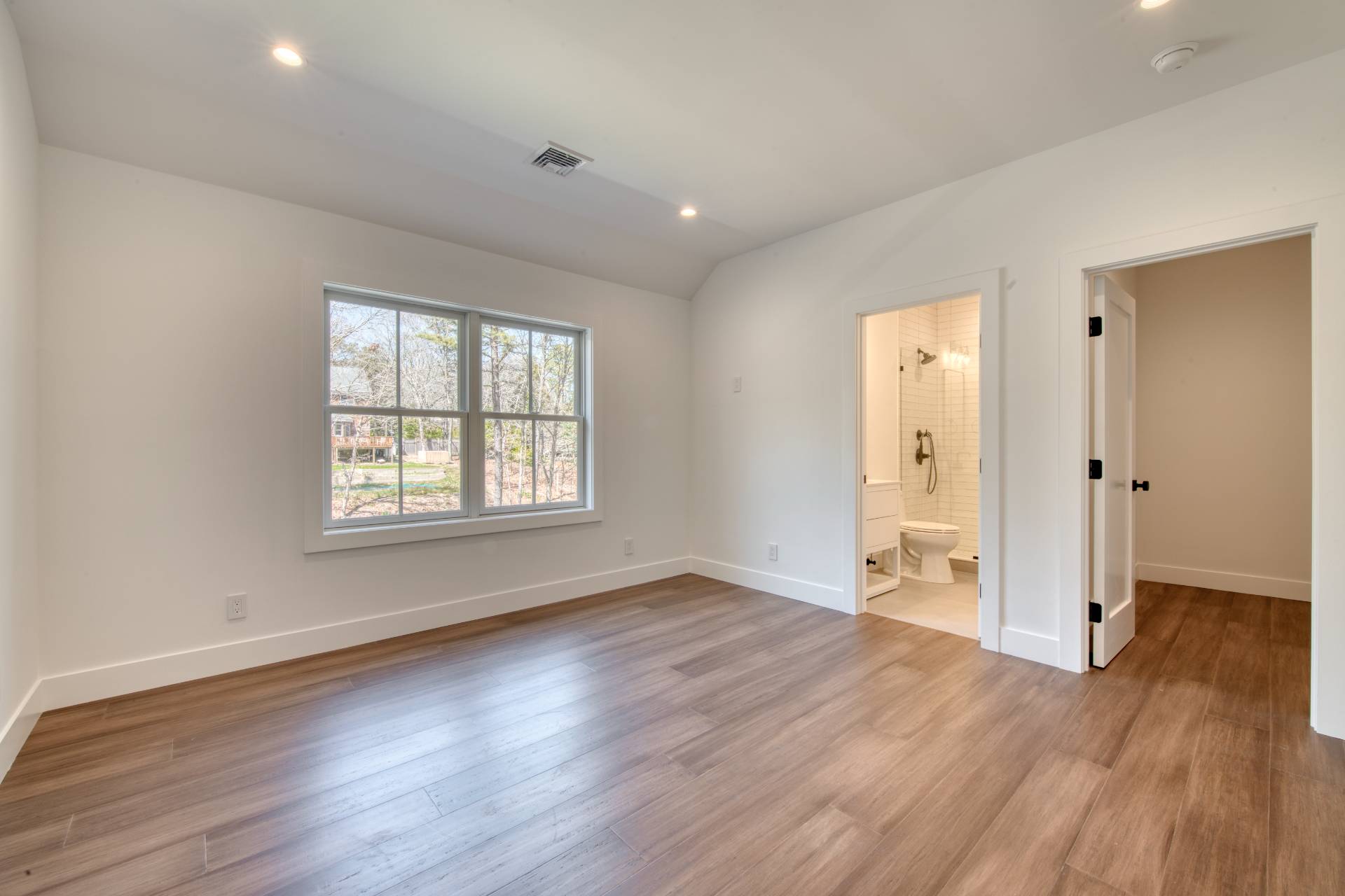 18 Barnes Avenue East Hampton, NY 11937 - Photo 19 of 35 an empty room with wooden floor and a window