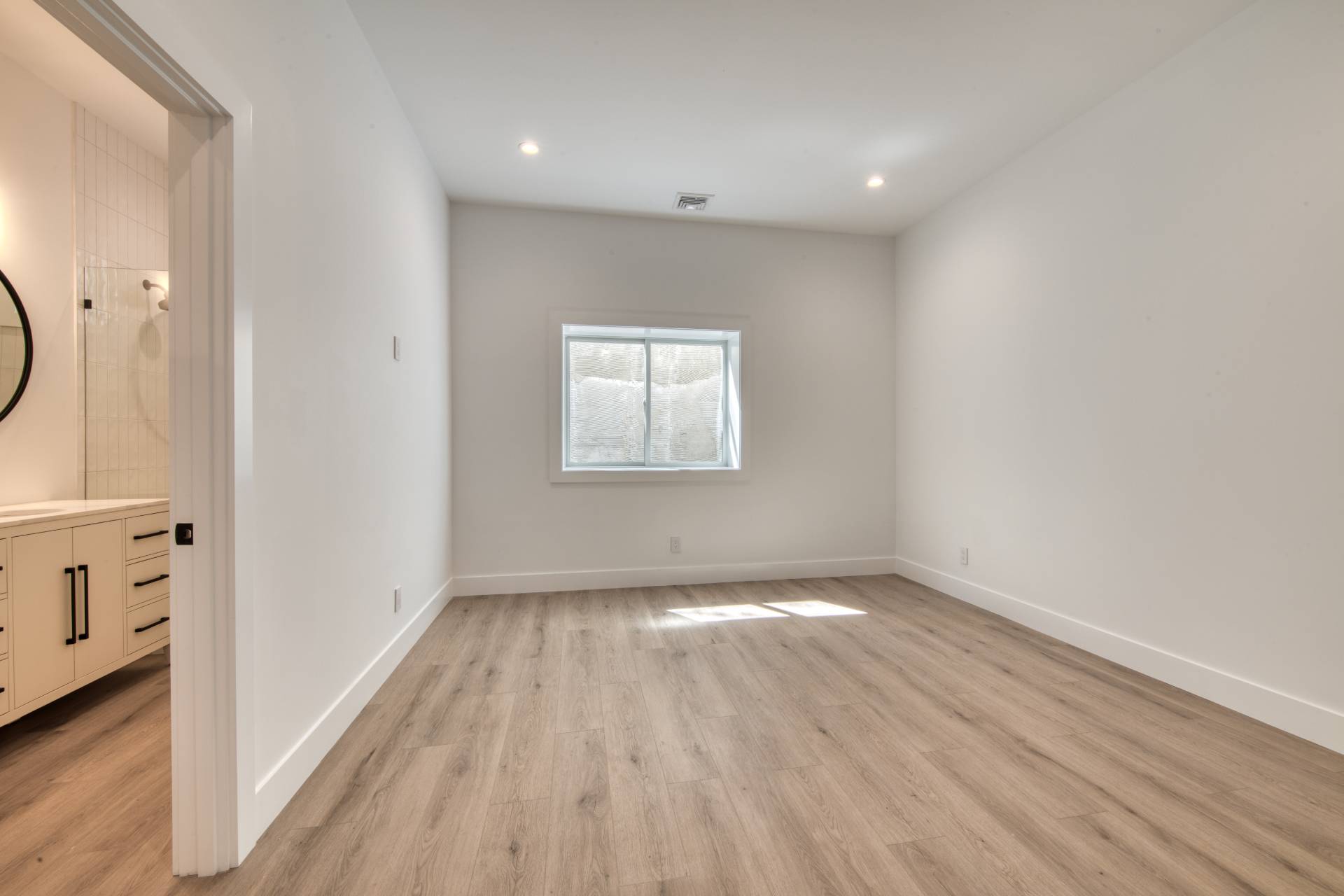 18 Barnes Avenue East Hampton, NY 11937 - Photo 23 of 35 a view of an empty room with wooden floor and a window