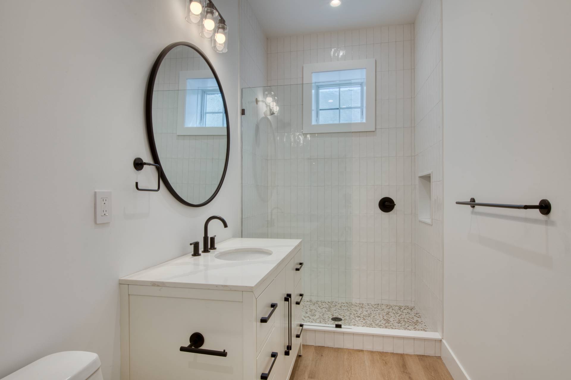 18 Barnes Avenue East Hampton, NY 11937 - Photo 24 of 35 a bathroom with a sink a toilet and a mirror