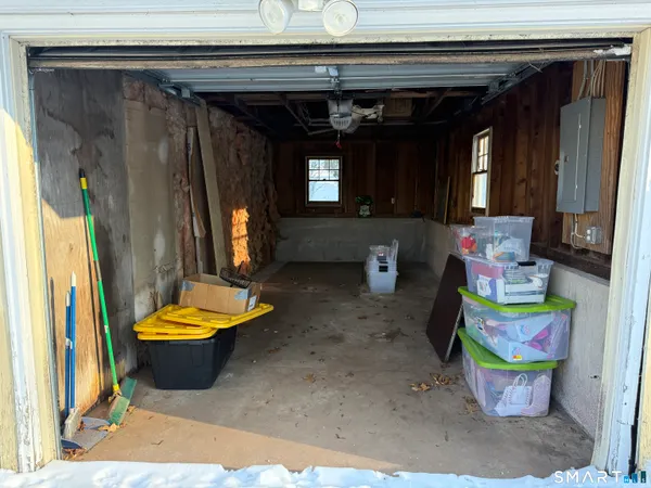 a living room filled with furniture and a window