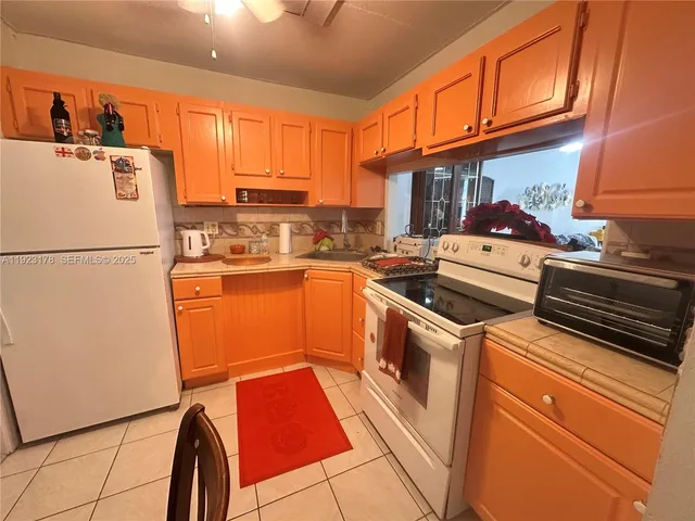 a bedroom with a bed and a mirror