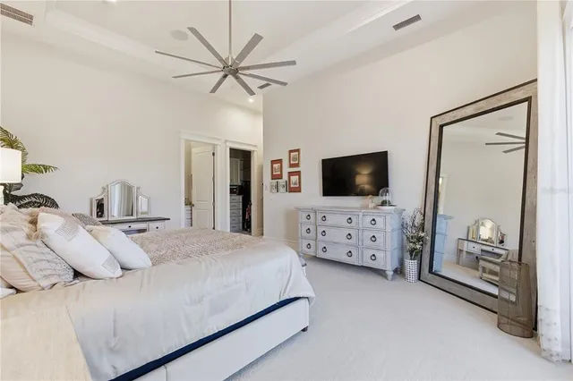 a living room with fireplace furniture and a large window