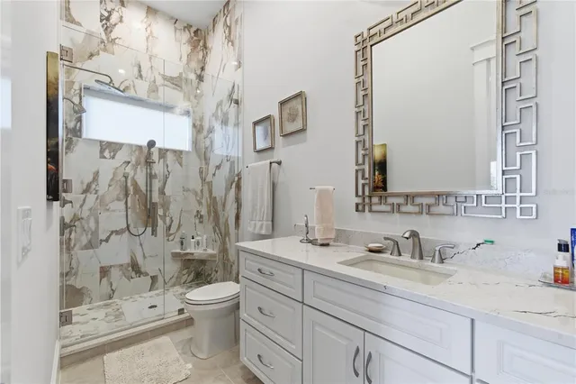 a living room with furniture a rug and a projector