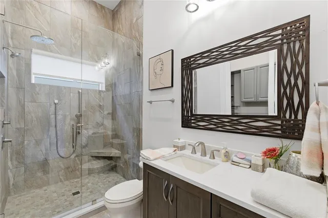 a room with furniture pool table flat screen tv and a large window