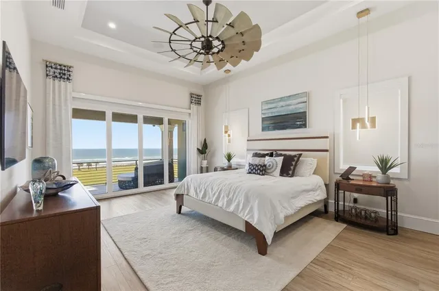 a living room with dining room and wooden floor