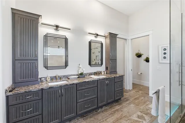 a bedroom with a bed dresser and a window