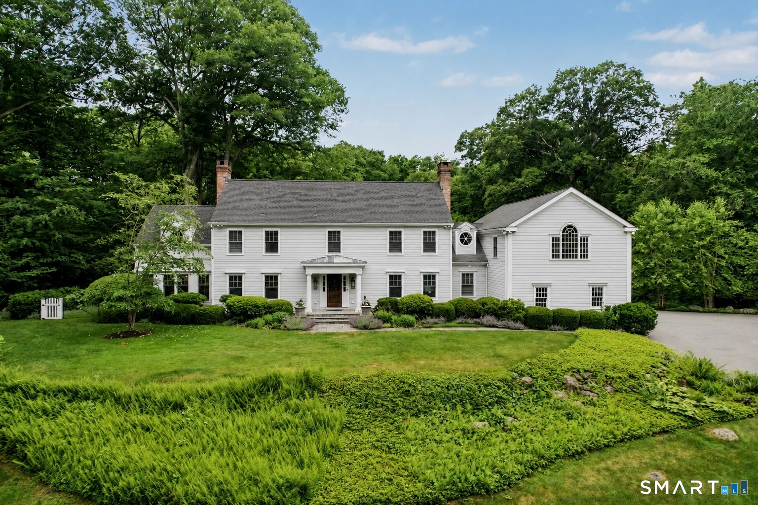 108 Logan Road New Canaan, CT 06840 - Photo 1 of 40 a house view with a outdoor space