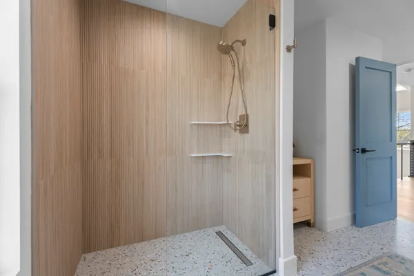 a bedroom with a bed and a view of bedroom
