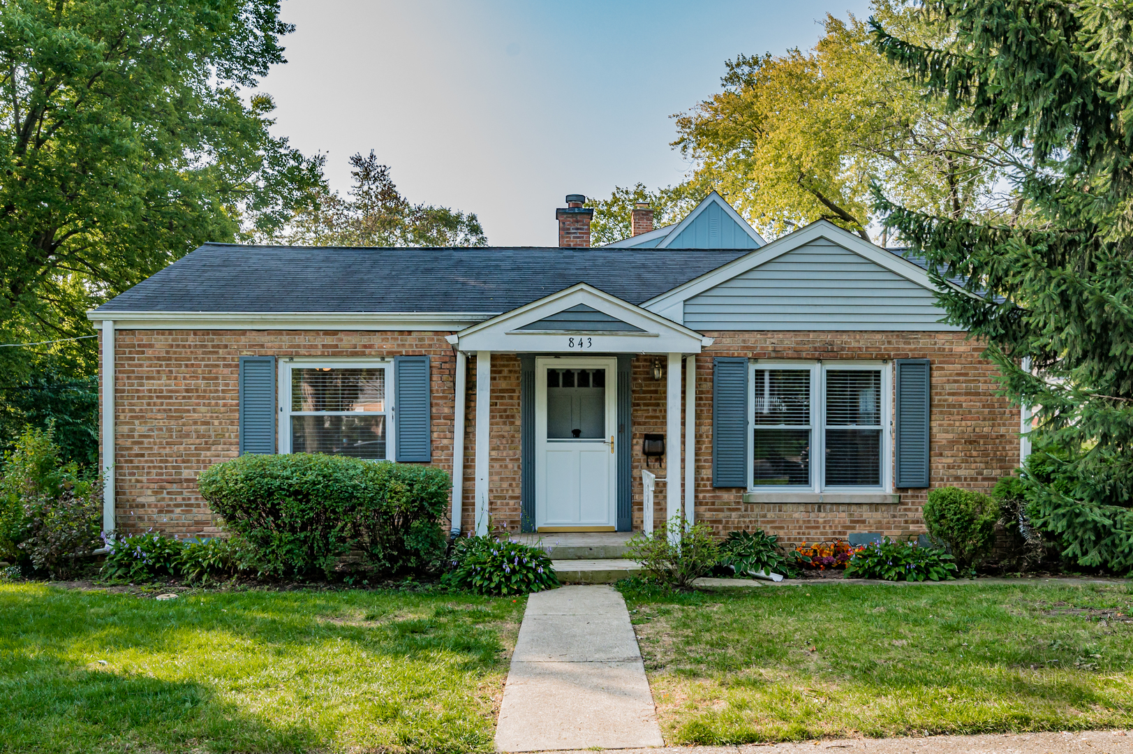 843 Pick Street Wheaton, IL 60187 - Photo 1 of 33 a front view of a house with a garden