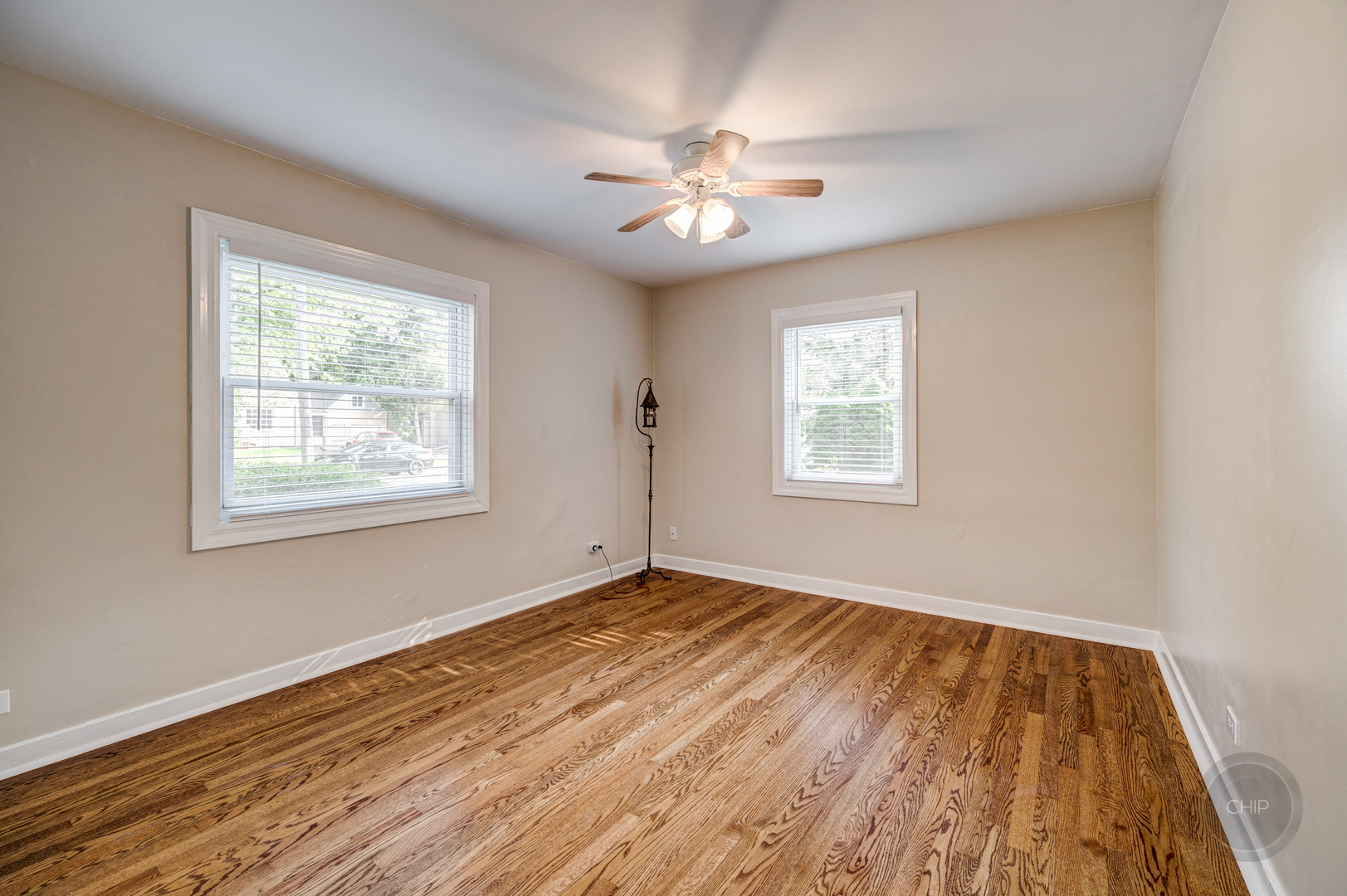 843 Pick Street Wheaton, IL 60187 - Photo 11 of 33 a view of an empty room with wooden floor and a window