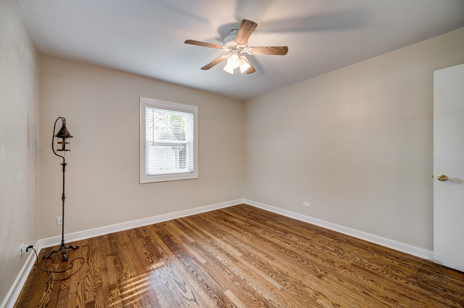 843 Pick Street Wheaton, IL 60187 - Photo 12 of 33 a view of empty room with wooden floor and fan