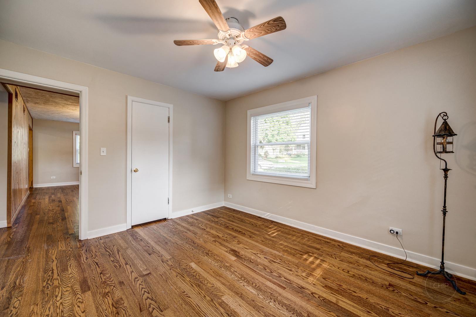 843 Pick Street Wheaton, IL 60187 - Photo 13 of 33 wooden floor in an empty room with a window