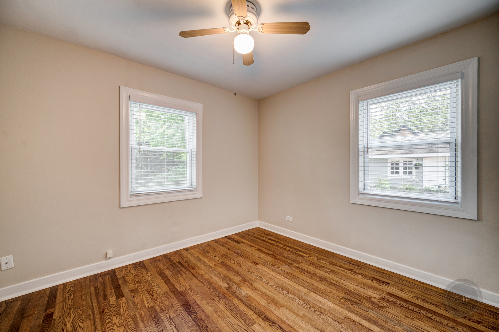 843 Pick Street Wheaton, IL 60187 - Photo 15 of 33 a view of empty room with wooden floor and fan