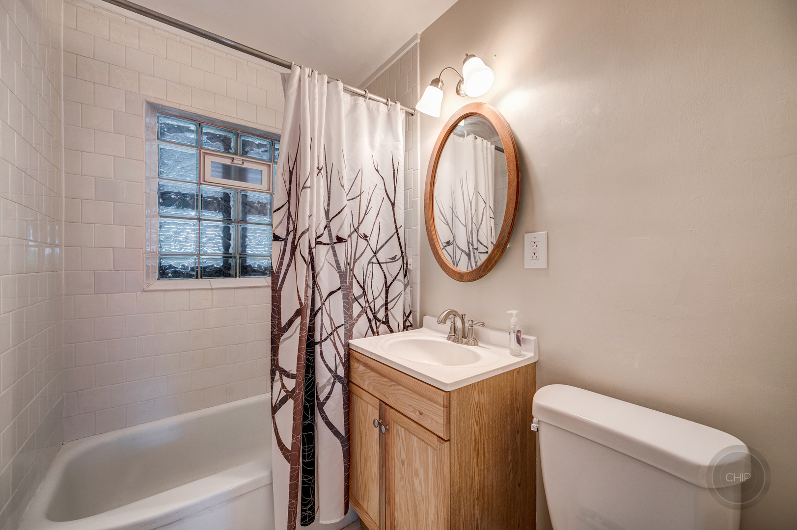 843 Pick Street Wheaton, IL 60187 - Photo 17 of 33 a bathroom with a toilet sink and mirror