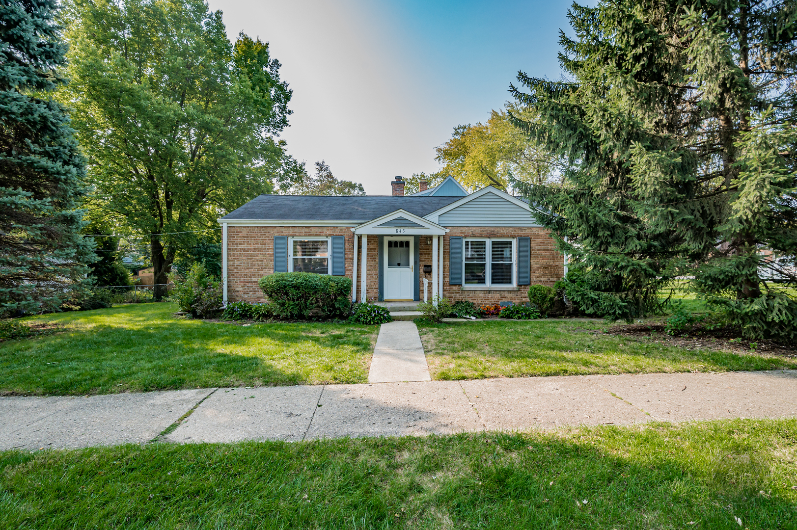 843 Pick Street Wheaton, IL 60187 - Photo 19 of 33 a front view of a house with a yard and garage