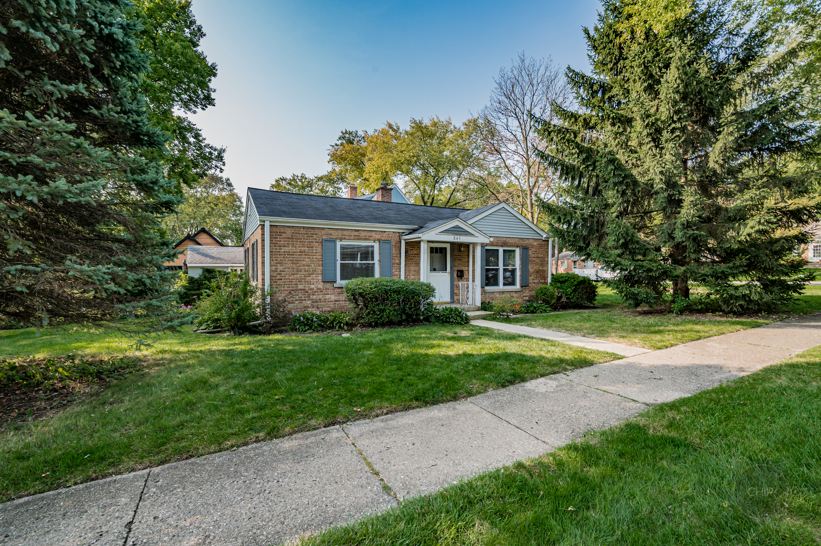 843 Pick Street Wheaton, IL 60187 - Photo 20 of 33 a yellow and red house with a garden
