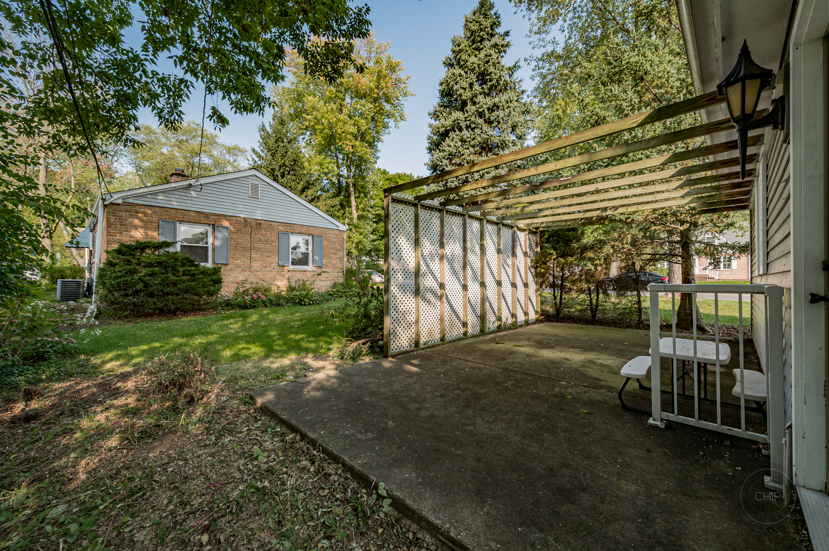 843 Pick Street Wheaton, IL 60187 - Photo 24 of 33 a view of a chair and table in backyard