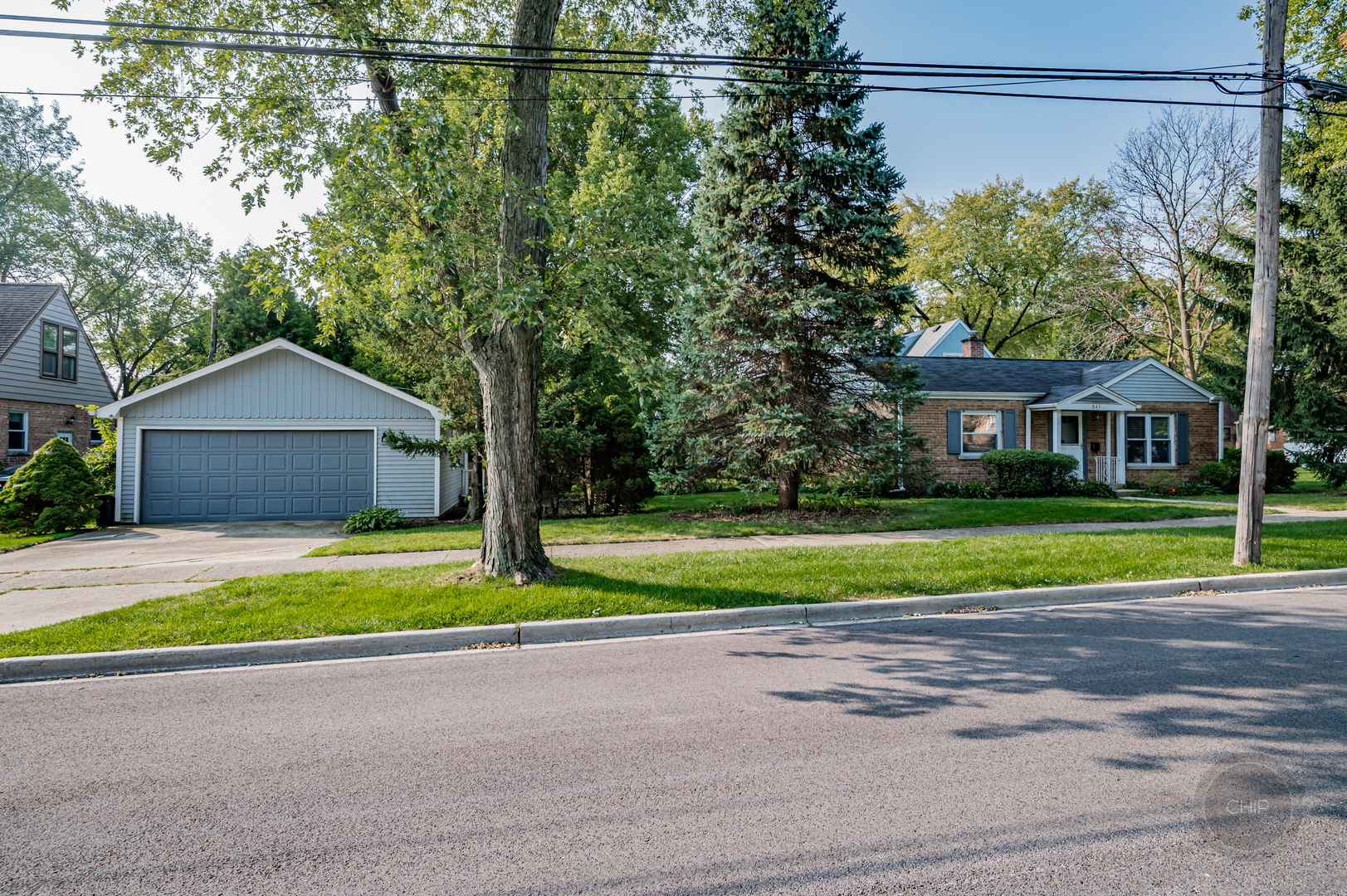 843 Pick Street Wheaton, IL 60187 - Photo 29 of 33 a front view of a house with a yard and garage