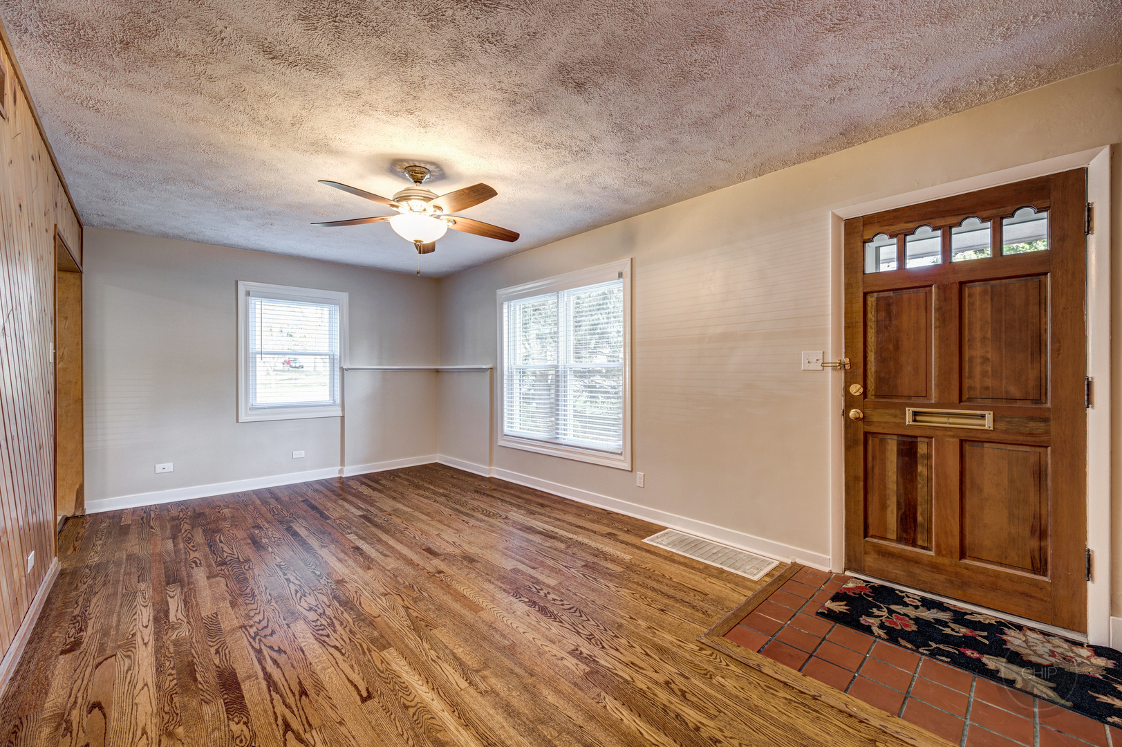 843 Pick Street Wheaton, IL 60187 - Photo 3 of 33 wooden floor in an empty room with a window