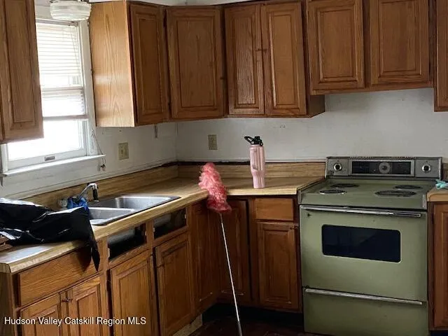 a kitchen with a stove and a microwave