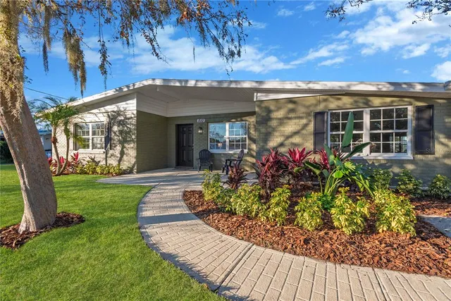 front view of a house with a garden