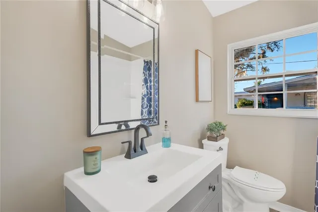 a view of a garden with a building in the background